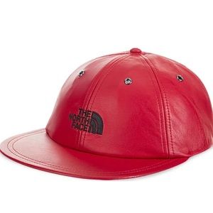Red leather supreme north face hat.  Good overall condition.